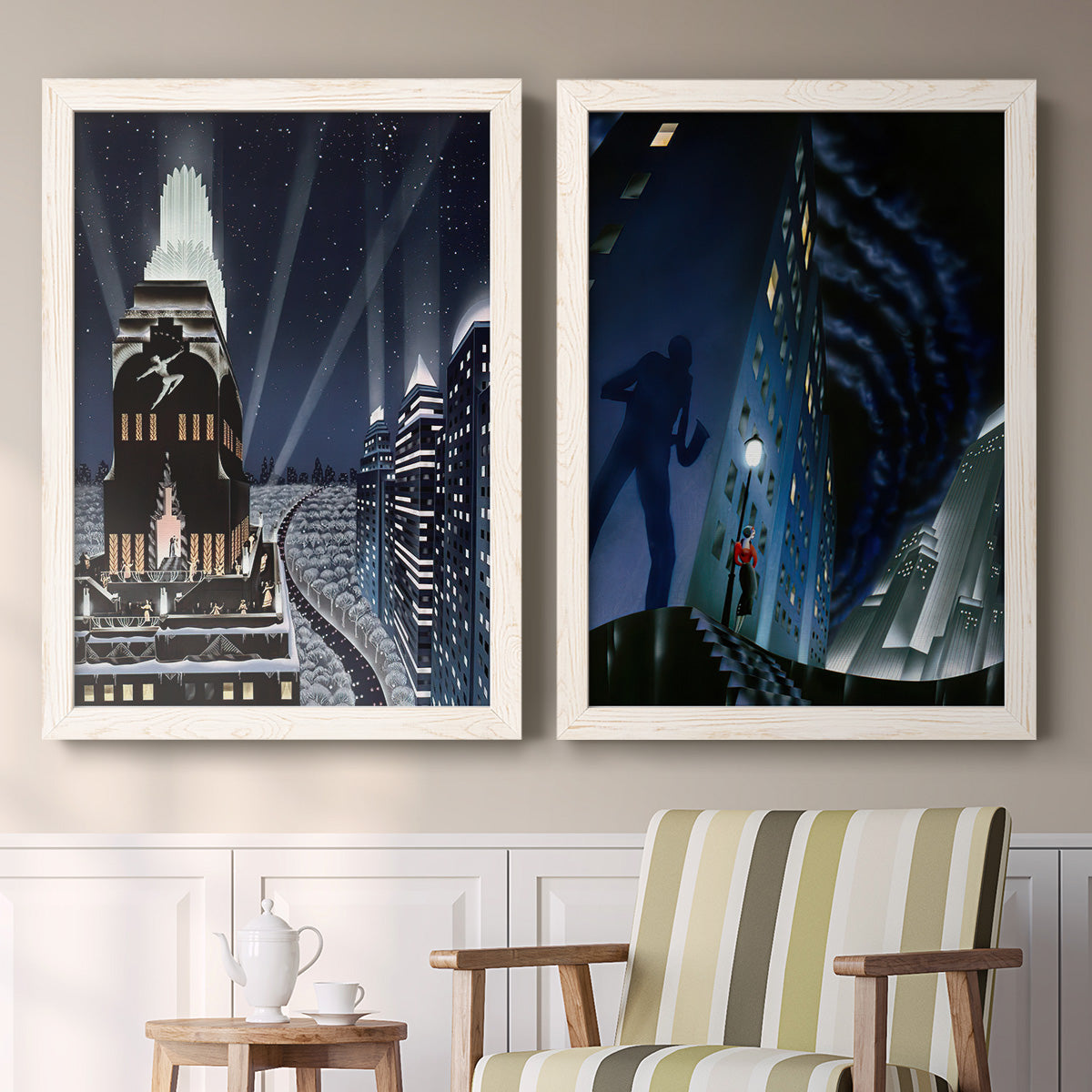 Set of two white barnwood framed canvas prints depicting two dramatic art deco city scenes with illuminated skyscrapers nighttime skies and elegant figures above a sideboard in a cozy sitting room.