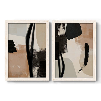 Set of two white barnwood framed canvas prints featuring two minimalist collage-like abstracts featuring black taupe cream and beige painted forms.