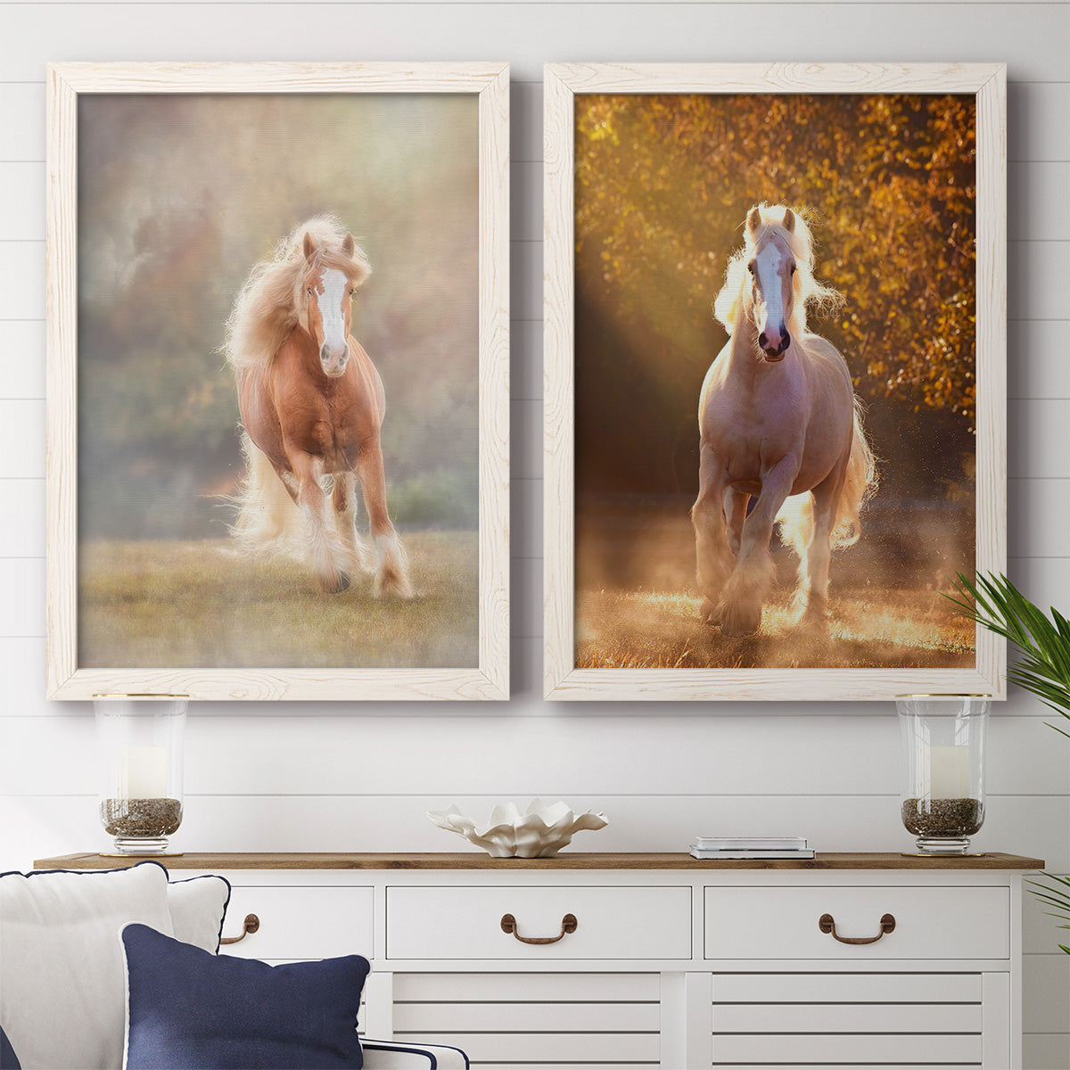 Set of two white barnwood framed canvas prints depicting a coordinated art pair of horses running through misty autumn light rendered as dramatic equestrian photography above a dining room sideboard.