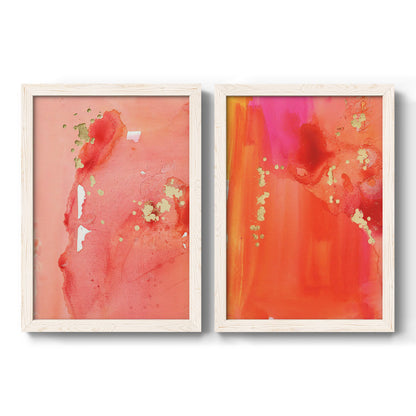 Set of two white barnwood framed canvas prints featuring two glamorous fluid abstracts featuring luminous coral orange and pink color fields with gold flecks.