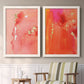 Set of two white barnwood framed canvas prints depicting two glamorous fluid abstracts featuring luminous coral orange and pink color fields with gold flecks above a sideboard in a cozy sitting room.