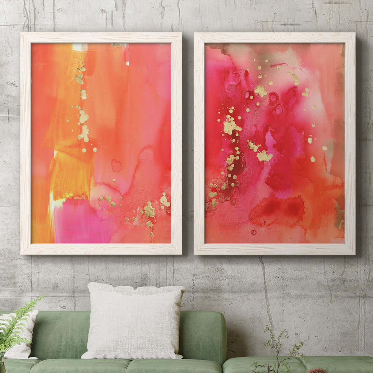 Set of two white barnwood framed canvas prints depicting a coordinated art pair of luminous coral orange and pink color fields with gold flecks rendered as glamorous fluid abstracts above a sofa in a modern living room.