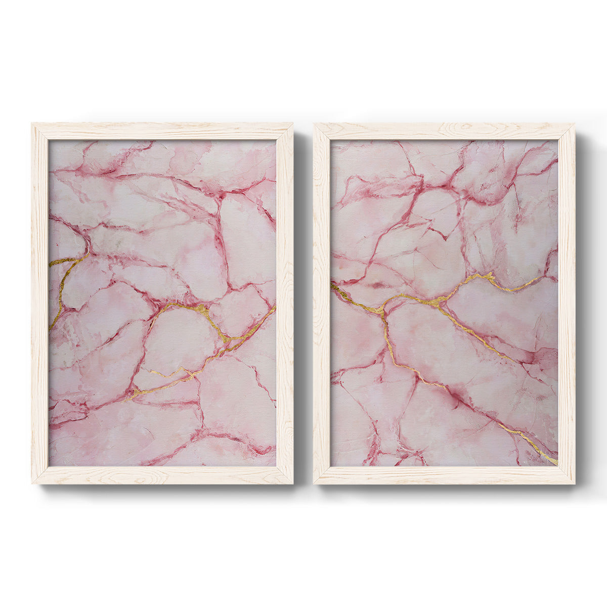 Set of two white barnwood framed canvas prints featuring two soft stone-inspired abstracts featuring pink marble veining with fine gold lines.