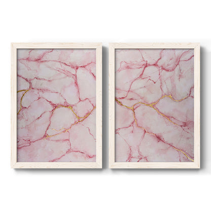 Set of two white barnwood framed canvas prints featuring two soft stone-inspired abstracts featuring pink marble veining with fine gold lines.