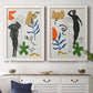Set of two white barnwood framed canvas prints depicting stylized female figures surrounded by blue leaves green starbursts orange forms and gestural marks above a dining room sideboard.