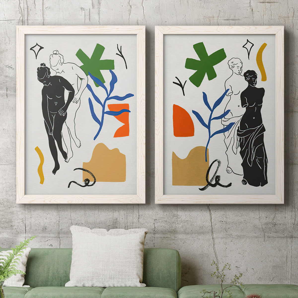 Set of two white barnwood framed canvas prints depicting a coordinated art pair of stylized female figures surrounded by botanical and geometric symbols rendered as graphic figurative collages above a sofa in a modern living room.