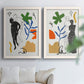 Set of two white barnwood framed canvas prints depicting black linework, bold green blue orange shapes, and classical statue poses arranged across two complementary compositions above a sofa in a bright living space.