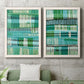 Set of two white barnwood framed canvas prints depicting a coordinated art pair of dense rows of teal black and white linear marks rendered as graphic woven-pattern abstracts above a sofa in a modern living room.