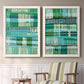Set of two white barnwood framed canvas prints depicting two graphic woven-pattern abstracts featuring dense rows of teal black and white linear marks above a sideboard in a cozy sitting room.