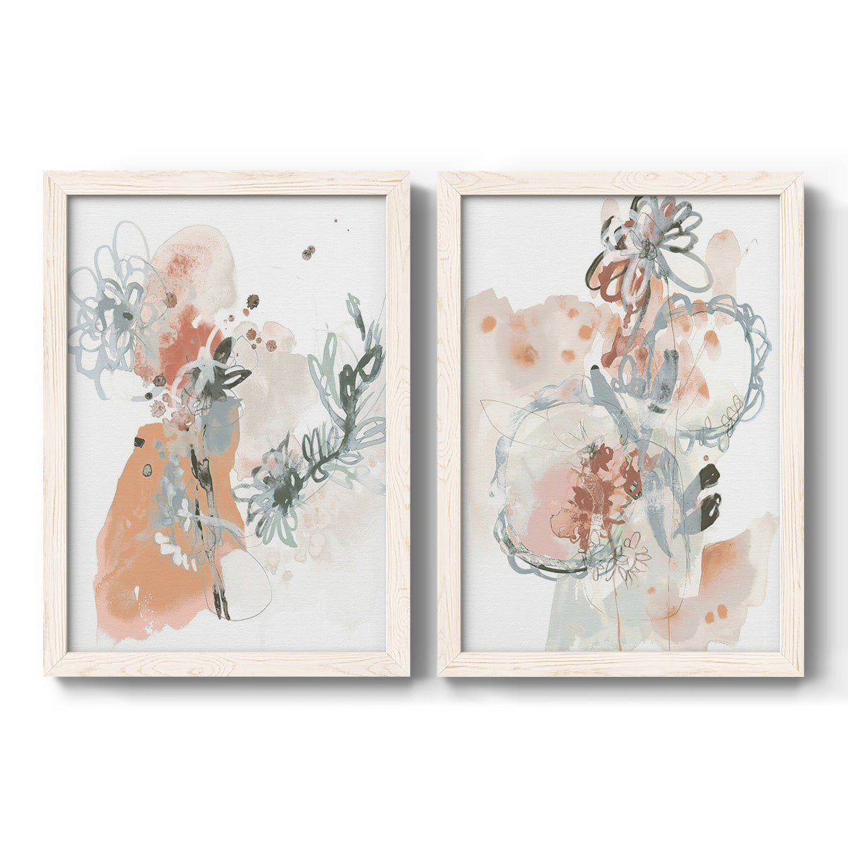 Set of two white barnwood framed canvas prints featuring two abstract watercolor botanicals featuring loose blush gray and coral floral gestures.