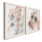 Angled view of a set of two white barnwood framed canvas prints featuring two abstract watercolor botanicals featuring loose blush gray and coral floral gestures.