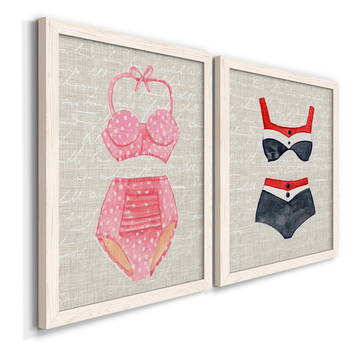 Angled view of a set of two white barnwood framed canvas prints featuring two vintage fashion illustrations featuring retro two-piece swimsuits displayed on textured linen grounds.