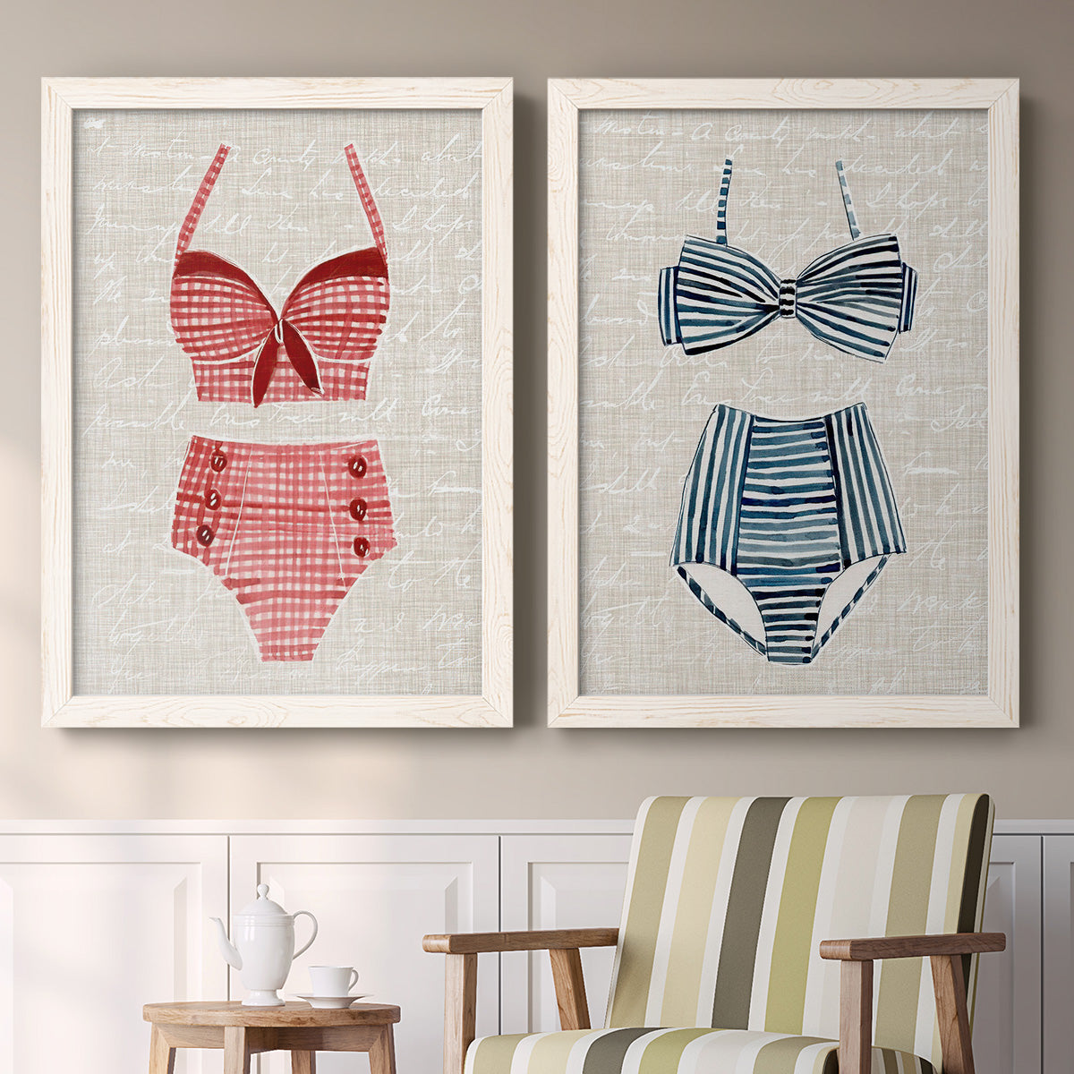 Set of two white barnwood framed canvas prints depicting two vintage fashion illustrations featuring retro two-piece swimsuits displayed on textured linen grounds above a sideboard in a cozy sitting room.