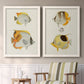 Set of two white barnwood framed canvas prints depicting two natural-history fish illustrations featuring groups of vintage tropical fish above a sideboard in a cozy sitting room.