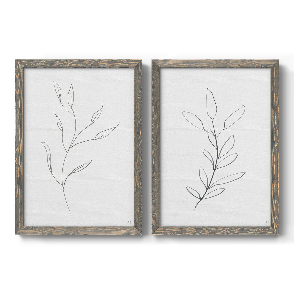Set of two gray barnwood framed canvas prints featuring two minimalist botanical line drawings featuring single continuous-line leafy branches.