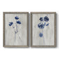 Set of two gray barnwood framed canvas prints featuring two rustic monochrome botanical paintings featuring blue wildflower stems on weathered neutral paper.