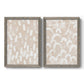 Set of two gray barnwood framed canvas prints featuring two tribal-inspired pattern abstracts featuring white hand-painted dashes arcs and chevrons.