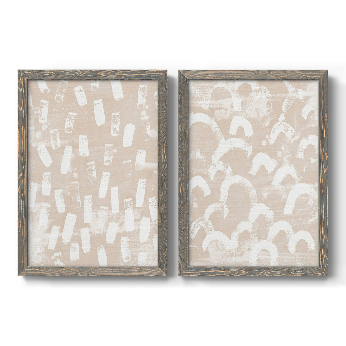 Set of two gray barnwood framed canvas prints featuring two tribal-inspired pattern abstracts featuring white hand-painted dashes arcs and chevrons.