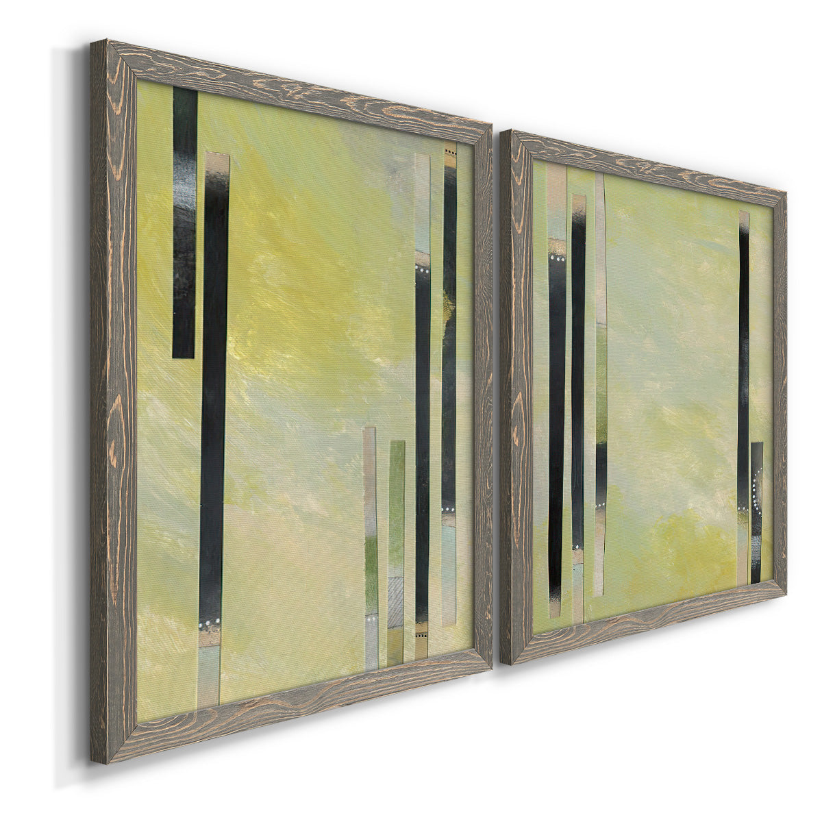Angled view of a set of two gray barnwood framed canvas prints featuring two minimalist architectural abstracts featuring vertical black gray and olive bars.
