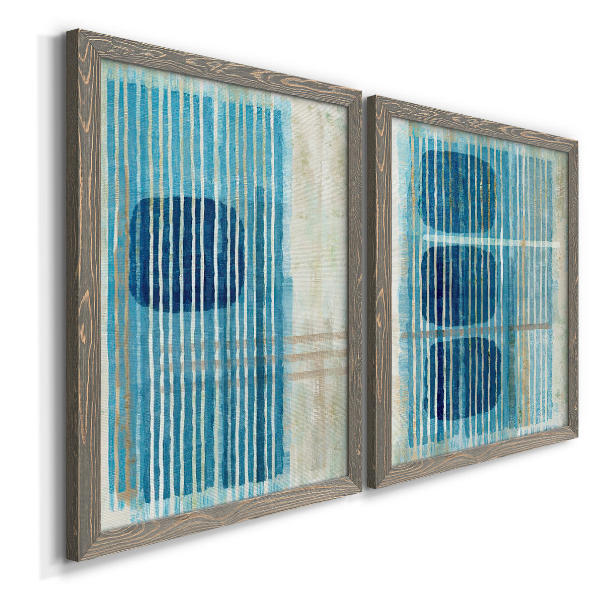 Angled view of a set of two gray barnwood framed canvas prints featuring two graphic geometric abstracts featuring stacked blue ovals behind fine vertical stripes.