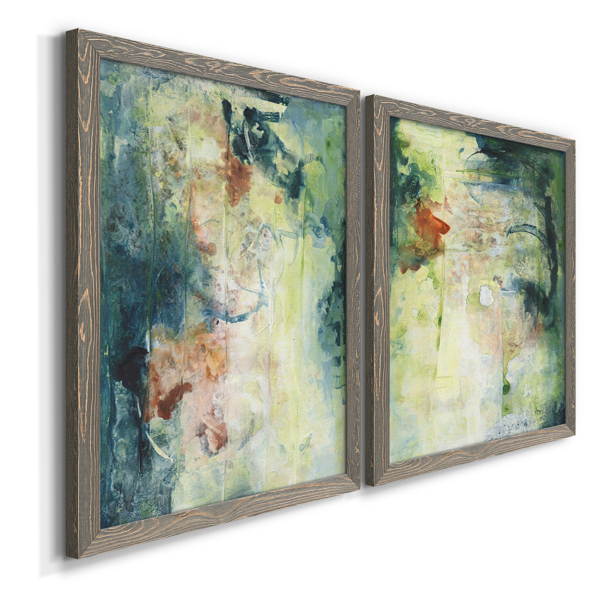 Angled view of a set of two gray barnwood framed canvas prints featuring two nature-inspired mixed-media abstracts featuring layered blue green cream and charcoal textures.
