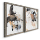 Angled view of a set of two gray barnwood framed canvas prints featuring two bold mixed-media abstracts featuring energetic black white tan and gray painted gestures.