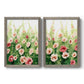 Set of two gray barnwood framed canvas prints featuring two luminous impressionistic floral paintings featuring a field of pink coral and white flowers.