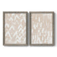 Set of two gray barnwood framed canvas prints featuring two tribal-inspired pattern abstracts featuring white hand-painted dashes arcs and chevrons.