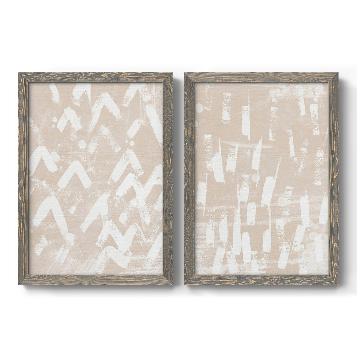 Set of two gray barnwood framed canvas prints featuring two tribal-inspired pattern abstracts featuring white hand-painted dashes arcs and chevrons.