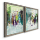 Angled view of a set of two gray barnwood framed canvas prints featuring two expressive contemporary abstracts featuring layered green purple and gray painterly forms.