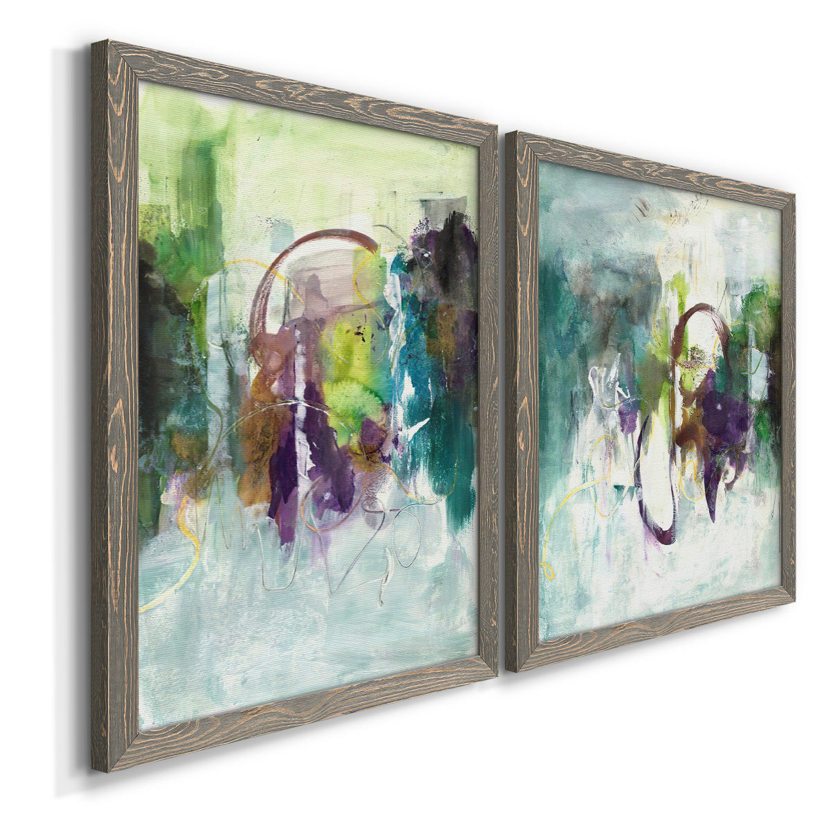 Angled view of a set of two gray barnwood framed canvas prints featuring two expressive contemporary abstracts featuring layered green purple and gray painterly forms.