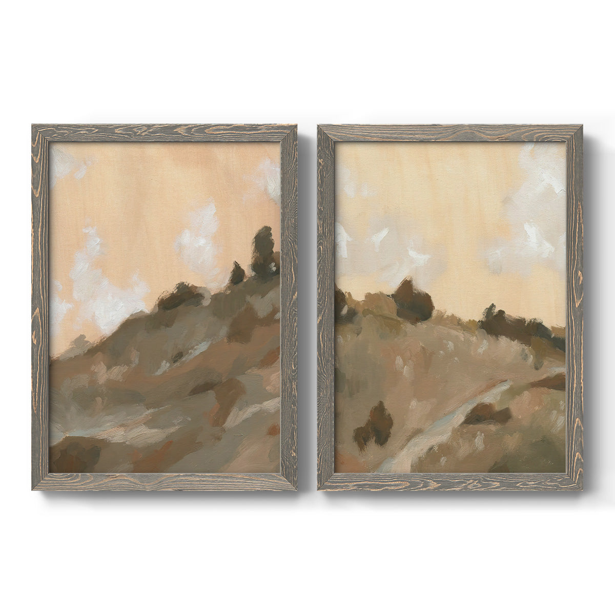 Set of two gray barnwood framed canvas prints featuring two minimalist watercolor landscapes featuring misty brown hills and winding mountain paths.