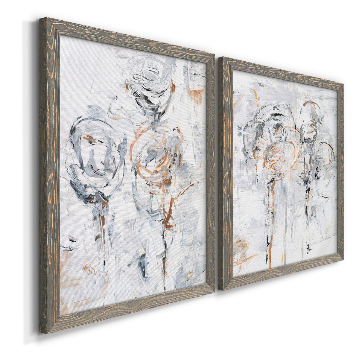 Angled view of a set of two gray barnwood framed canvas prints featuring two expressive floral abstracts featuring loosely suggested flowers and stems in pale gray and peach.