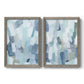 Set of two gray barnwood framed canvas prints featuring two cool-toned geometric abstracts featuring fragmented pale blue green gray and white brush blocks.
