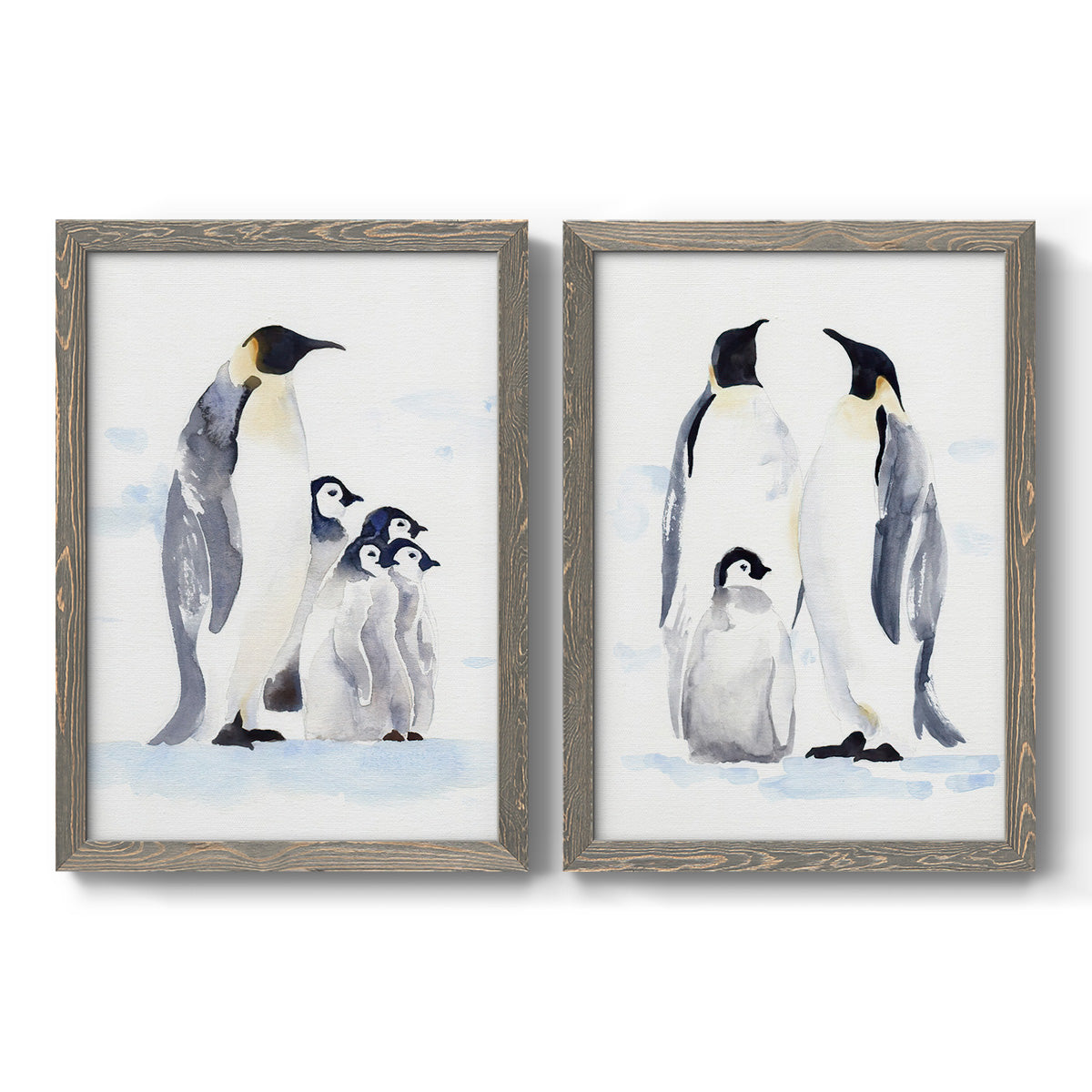 Set of two gray barnwood framed canvas prints featuring two soft watercolor wildlife illustrations featuring adult emperor penguins with fluffy chicks.