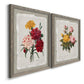 Angled view of a set of two gray barnwood framed canvas prints featuring two traditional botanical collage prints featuring vintage mixed-flower bouquets on distressed paper.