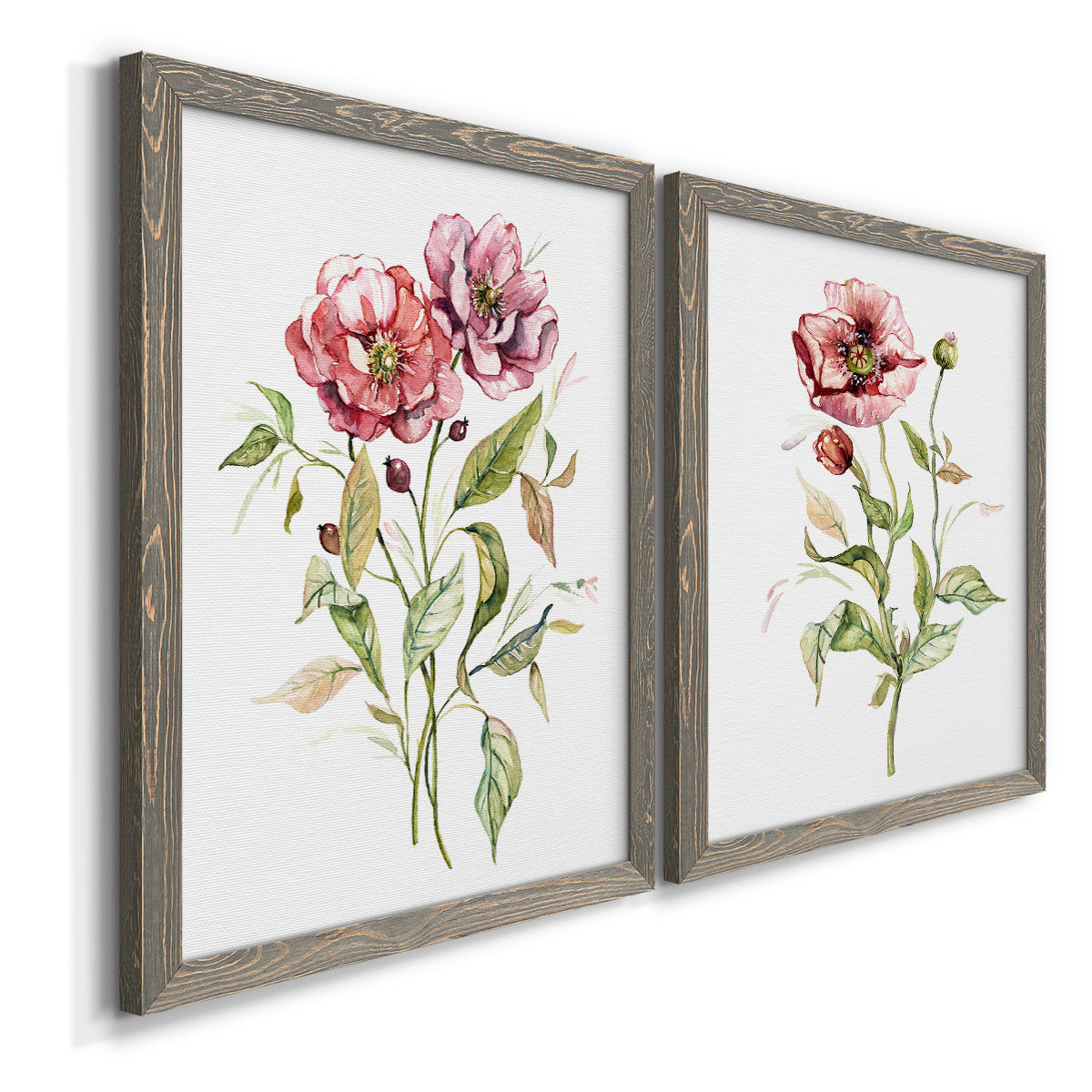 Angled view of a set of two gray barnwood framed canvas prints featuring two traditional watercolor flower studies featuring two airy wildflower stems with pink and burgundy blossoms.