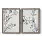 Set of two gray barnwood framed canvas prints featuring two minimalist botanical sketches featuring black line drawings of wildflowers and leaves.