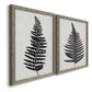 Angled view of a set of two gray barnwood framed canvas prints featuring two minimalist botanical prints featuring black fern leaf silhouettes.