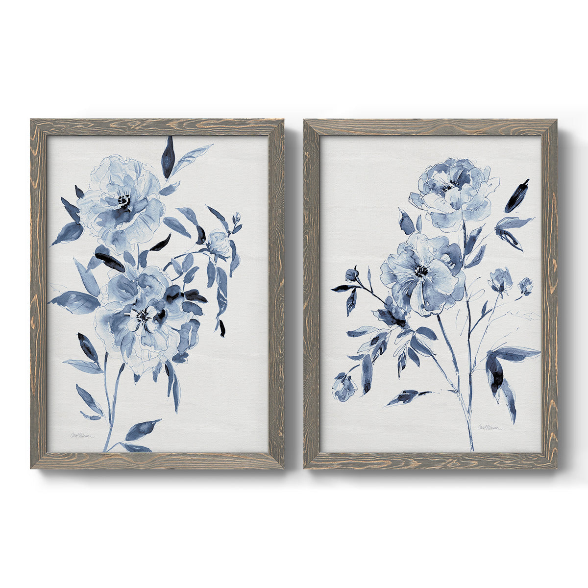 Set of two gray barnwood framed canvas prints featuring two expressive watercolor botanical paintings featuring loose blue flowers and leafy branches.
