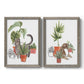 Set of two gray barnwood framed canvas prints featuring two whimsical botanical animal illustrations featuring cats tucked among collections of potted houseplants.