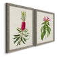 Angled view of a set of two gray barnwood framed canvas prints featuring two vintage botanical plate illustrations featuring pink flowering plant specimens.