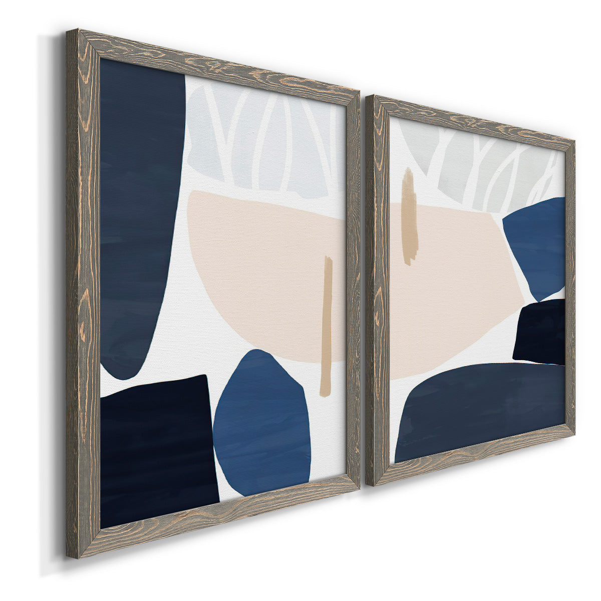 Angled view of a set of two gray barnwood framed canvas prints featuring two minimalist color-block abstracts featuring large navy cream and beige organic geometric shapes.