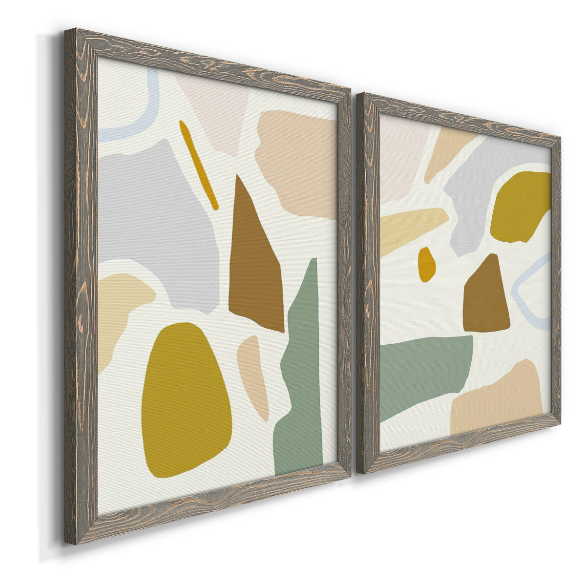 Angled view of a set of two gray barnwood framed canvas prints featuring two pastel geometric abstracts featuring soft mustard sage gray and white irregular shapes.