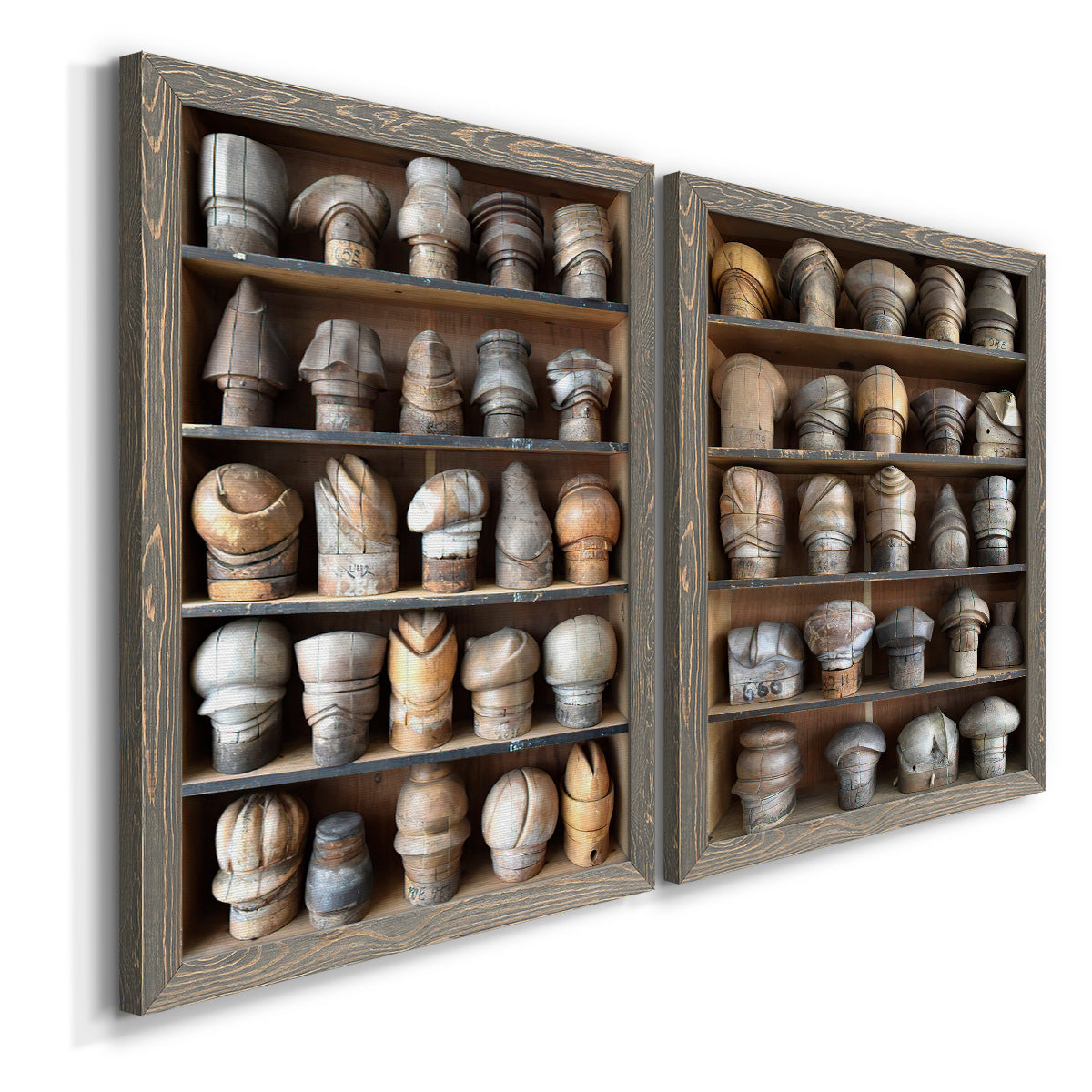 Angled view of a set of two gray barnwood framed canvas prints featuring two fashion-object photography featuring shelves filled with wooden hat forms.
