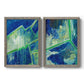 Set of two gray barnwood framed canvas prints featuring two textured geometric abstracts featuring interlocking blue and green angular forms.