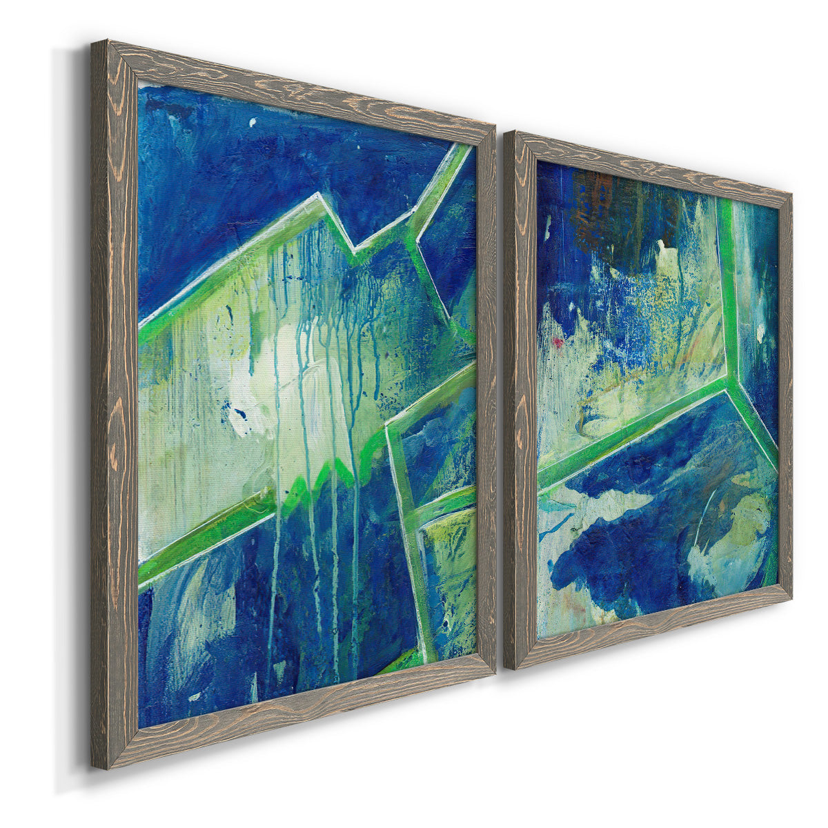 Angled view of a set of two gray barnwood framed canvas prints featuring two textured geometric abstracts featuring interlocking blue and green angular forms.