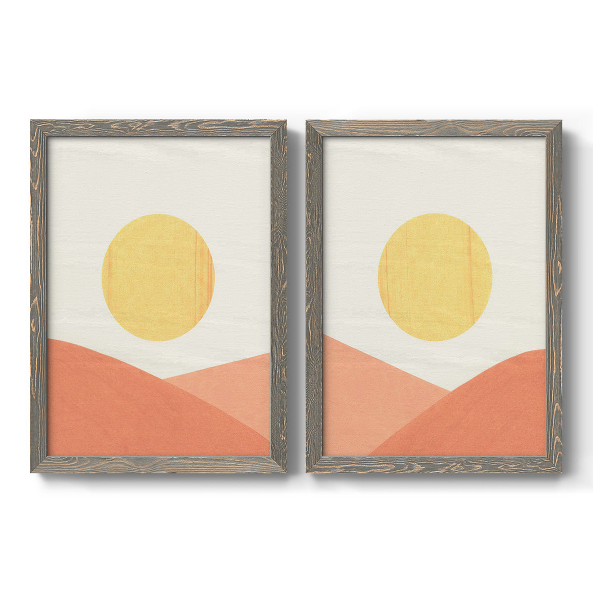 Set of two gray barnwood framed canvas prints featuring two minimalist boho landscapes featuring yellow suns rising over terracotta geometric hills.