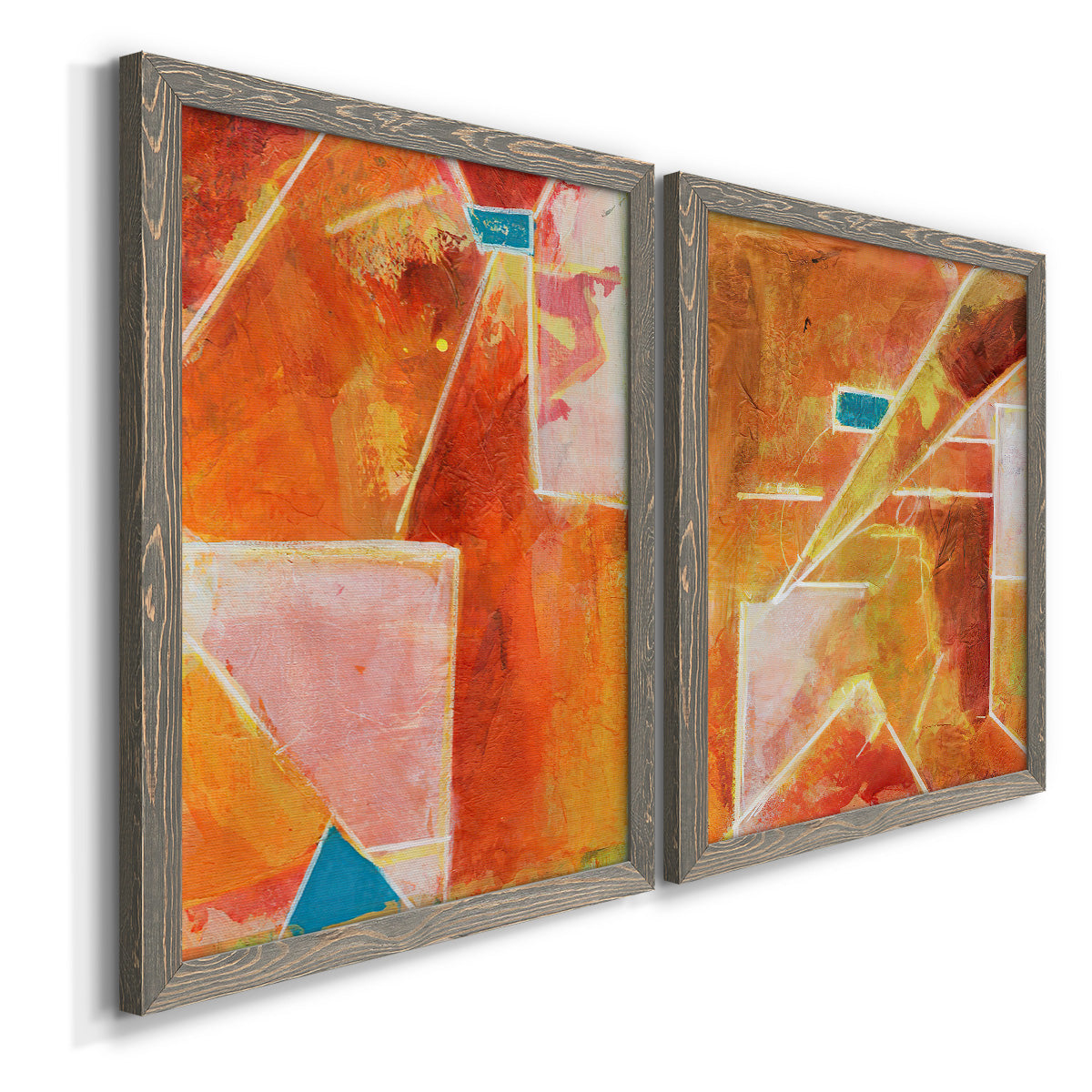 Angled view of a set of two gray barnwood framed canvas prints featuring two warm geometric abstracts featuring faceted rust orange and coral geometric fields.