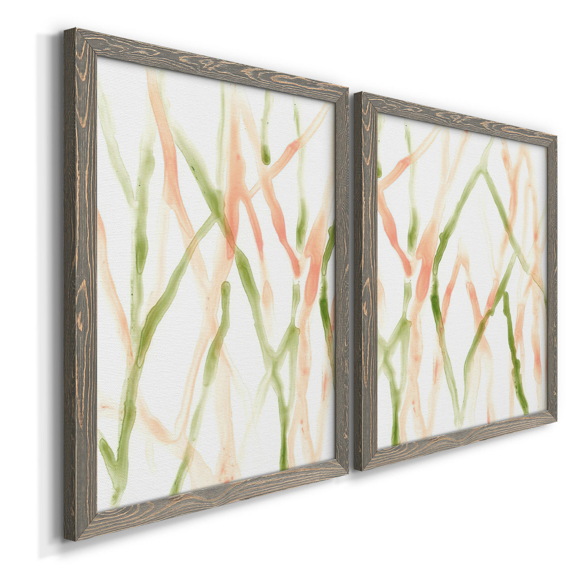 Angled view of a set of two gray barnwood framed canvas prints featuring two fluid organic abstracts featuring branching watercolor lines drifting across white.